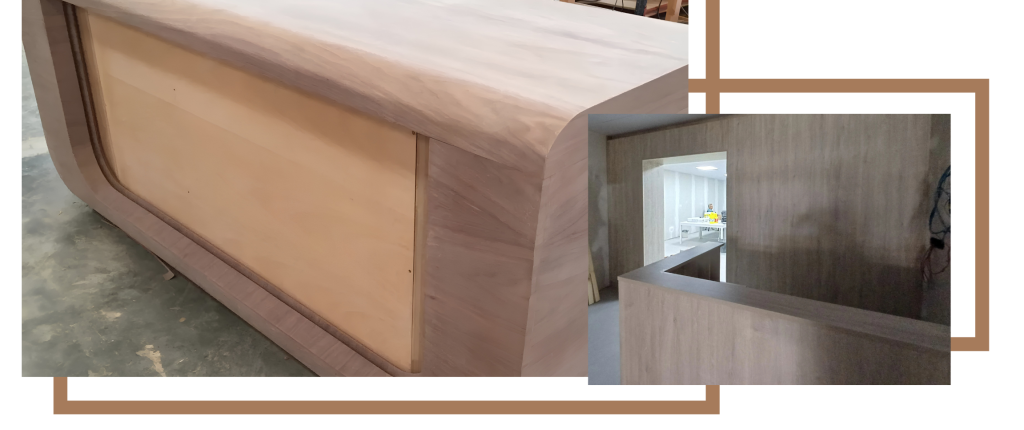 Fabricación artesanal de mostrador curvo de madera en el taller.